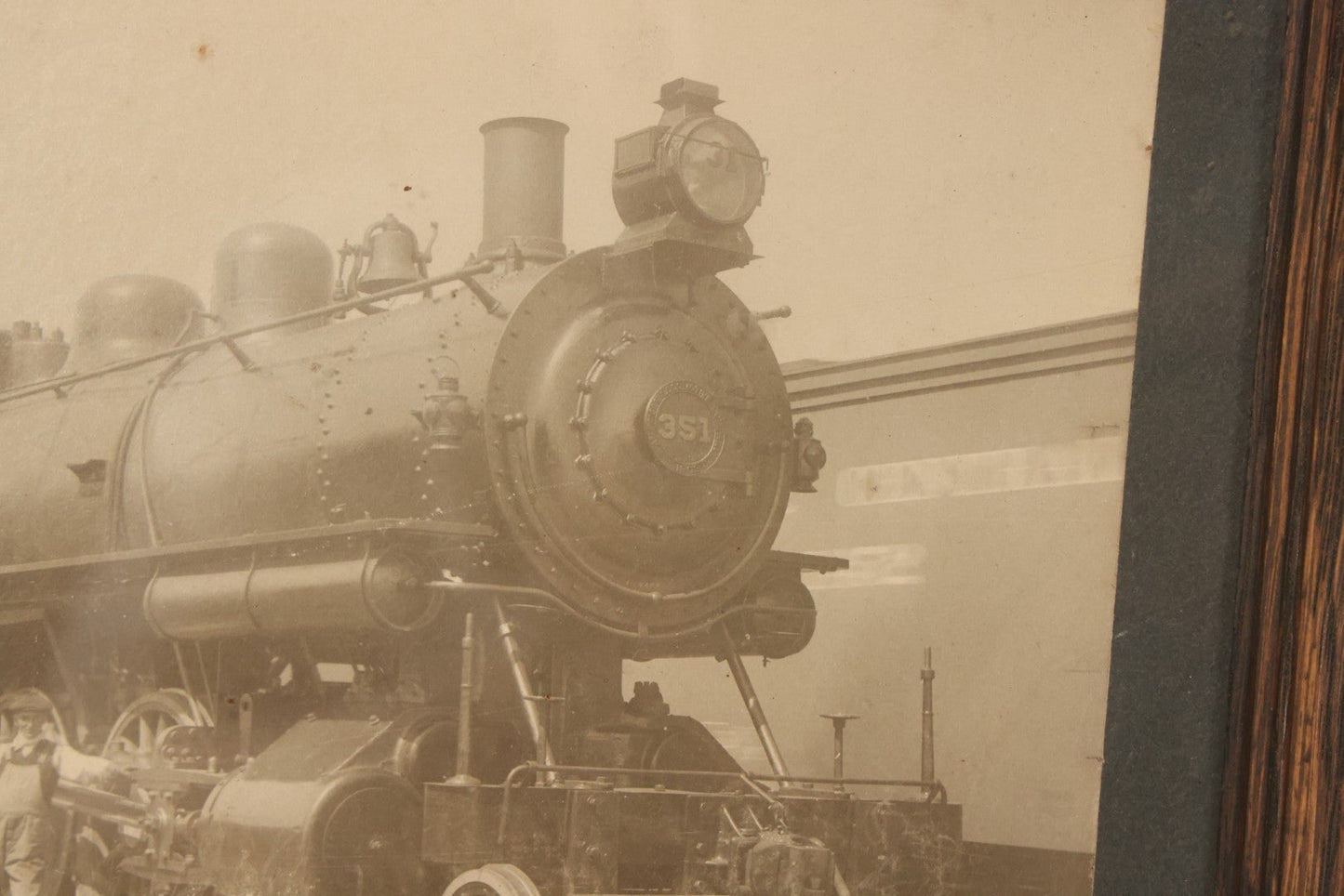 Lot 038 - Antique Boarded Occupational Photograph Of Locomotive 351 By American Locomotive Company, Maine Central Railroad, With Railroad Workers In Photo, Circa 1909 Partial Id On Verso, In Frame, Note Wear, 12-3/8" x 10-3/8"