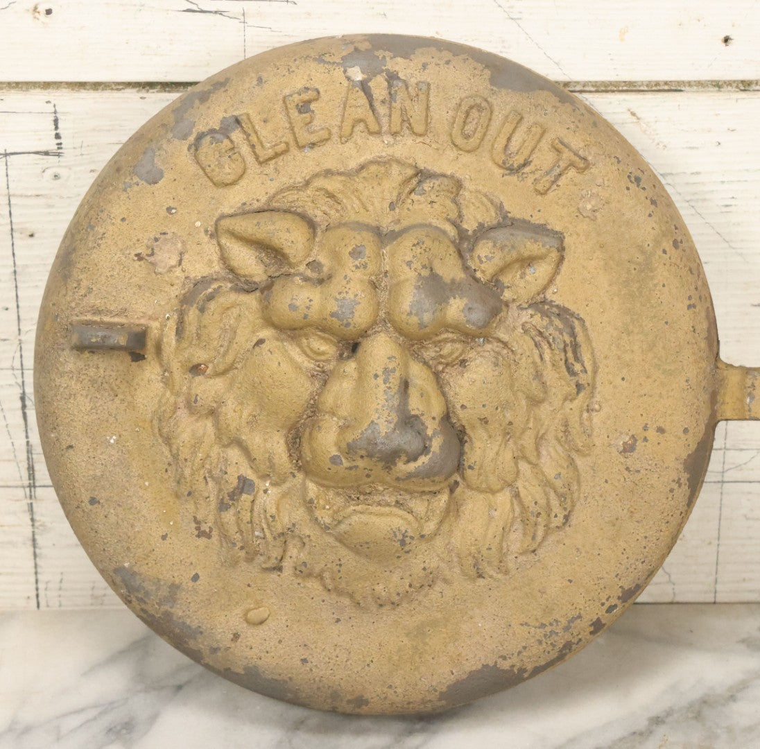 Lot 048 - Antique Cast Iron Stove Cleanout Door With Three Dimensional Lion Face, Gold Paint, 10" Diameter