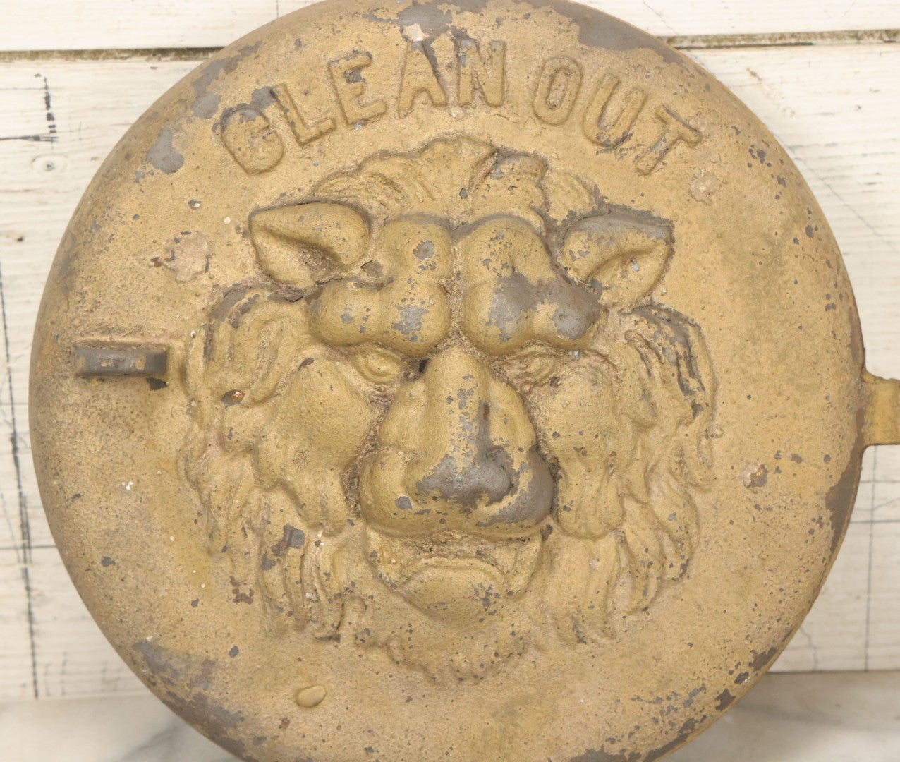 Lot 048 - Antique Cast Iron Stove Cleanout Door With Three Dimensional Lion Face, Gold Paint, 10" Diameter