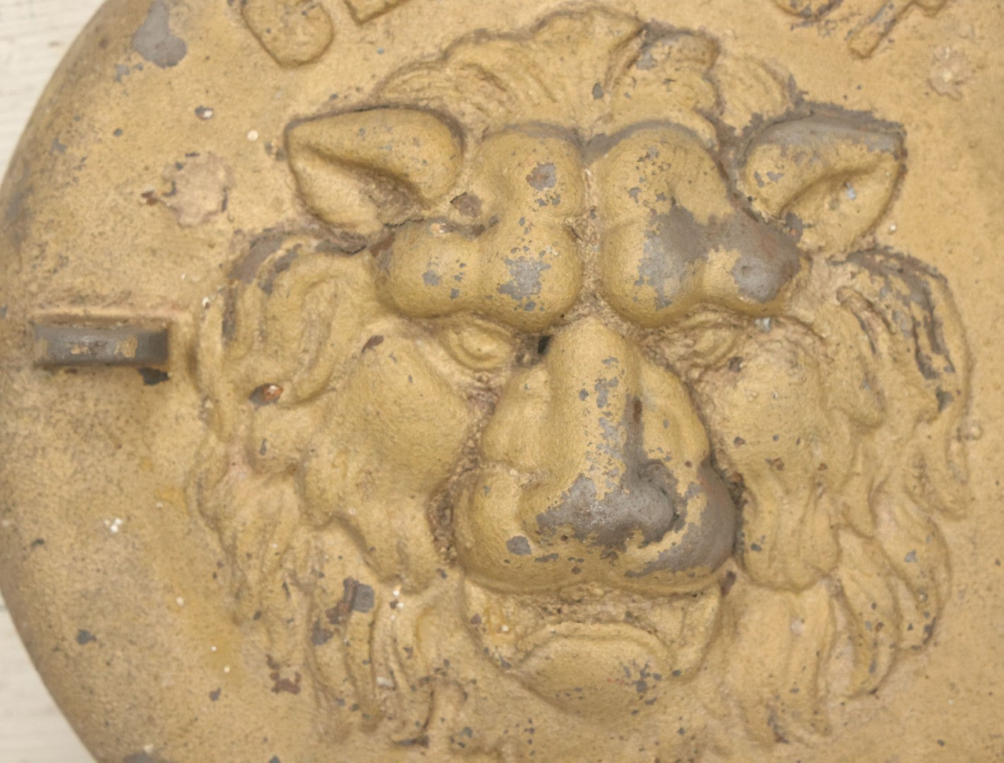 Lot 048 - Antique Cast Iron Stove Cleanout Door With Three Dimensional Lion Face, Gold Paint, 10" Diameter