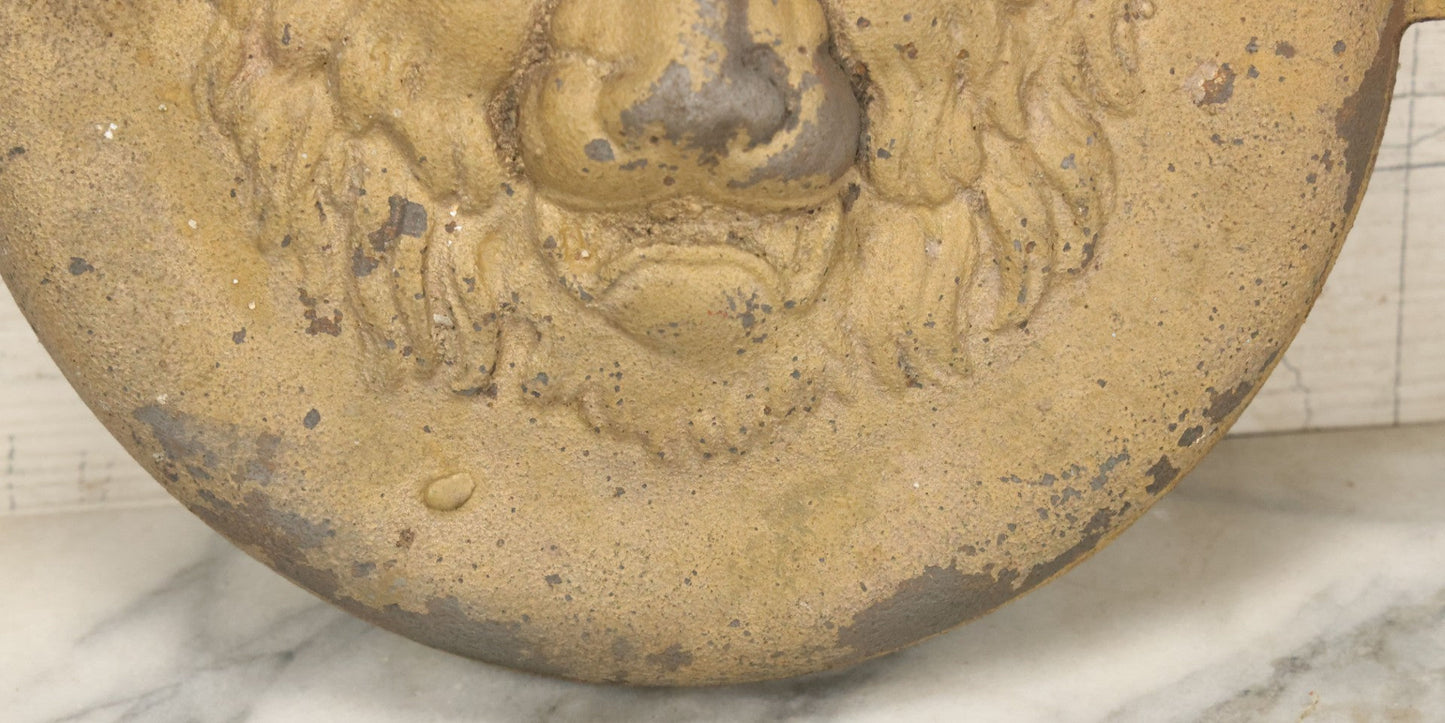 Lot 048 - Antique Cast Iron Stove Cleanout Door With Three Dimensional Lion Face, Gold Paint, 10" Diameter