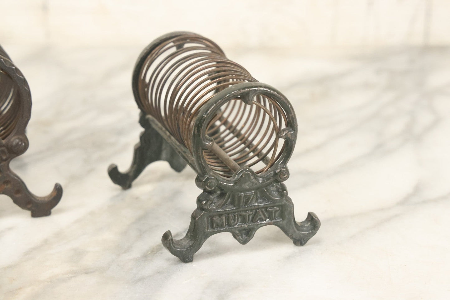Lot 071 - Pair Of Vintage Cast Iron Spring Coil Letter Holders With Legs, Boots, One By K. Diamond, One By Mutat, No. 17 In Old Green Paint