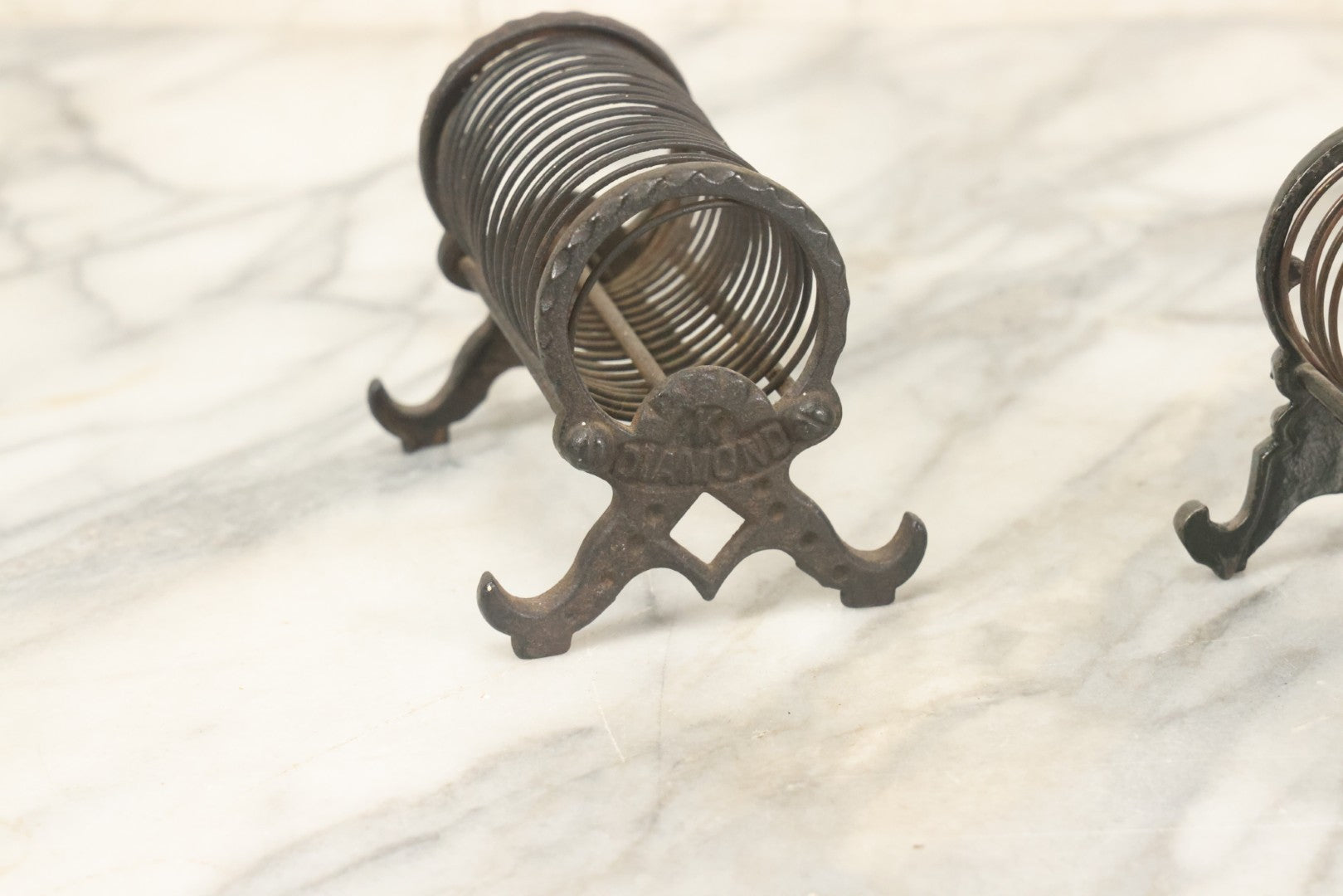 Lot 071 - Pair Of Vintage Cast Iron Spring Coil Letter Holders With Legs, Boots, One By K. Diamond, One By Mutat, No. 17 In Old Green Paint