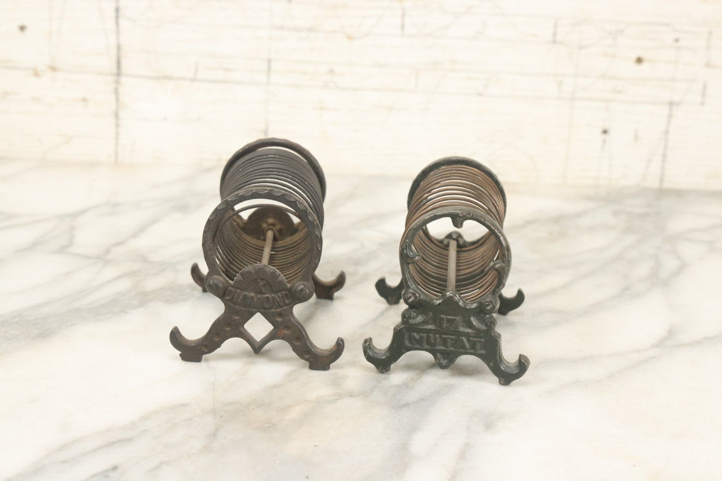 Lot 071 - Pair Of Vintage Cast Iron Spring Coil Letter Holders With Legs, Boots, One By K. Diamond, One By Mutat, No. 17 In Old Green Paint