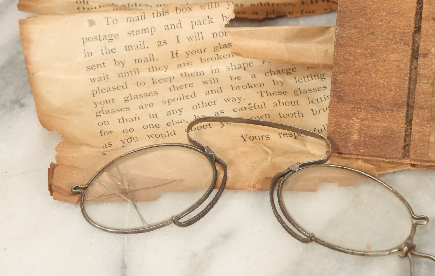 Lot 079 - Antique Slide Top Wooden Mailing Box From Edward E Dammers, Optician, Worcester, Massachusetts, Containing Two Pairs Of Antique Eyeglasses And Advertising Ephemera, Addressed To Mary Fickett, As Found, Note Cracks And Wear