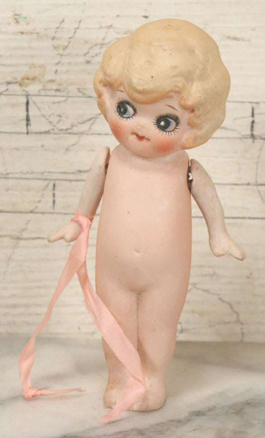Lot 095 - Vintage Bisque Hand Painted Flapper Doll, Made In Japan, With Blond Hair And Pink Ribbon Around Wrist, Approximately 6" Height