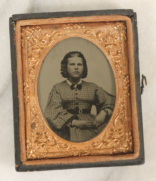 Lot 101 - Antique 1/9th Plate Ruby Ambrotype Photograph Of Young Woman In Checkered Dress With Braided Hairstyle And Many Pieces Of Jewelry In Half Leatherette Union Case, Note Case Worn