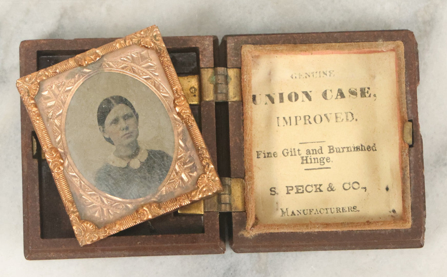 Lot 105 - Antique 1/16th Plate Tintype Photograph Of Young Woman With Short Hair And White Collar, In Thermoplastic Union Case, By S. Peck & Co. Manufacturers, Note No Interior Case Pillow