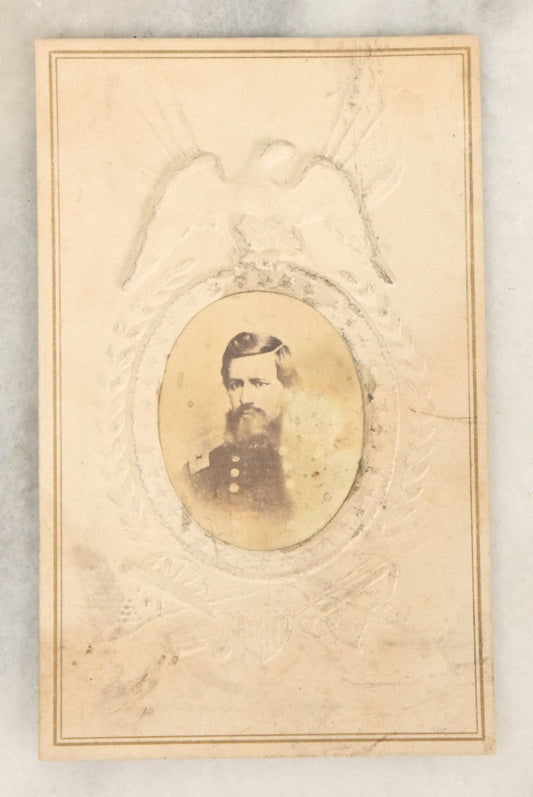 Lot 109 - Single Antique Carte De Visite C.D.V. Photograph Of Civil War Era Soldier, Applied To Embossed Paper, Patriotic Frame With Eagle, Cannons, Etc.