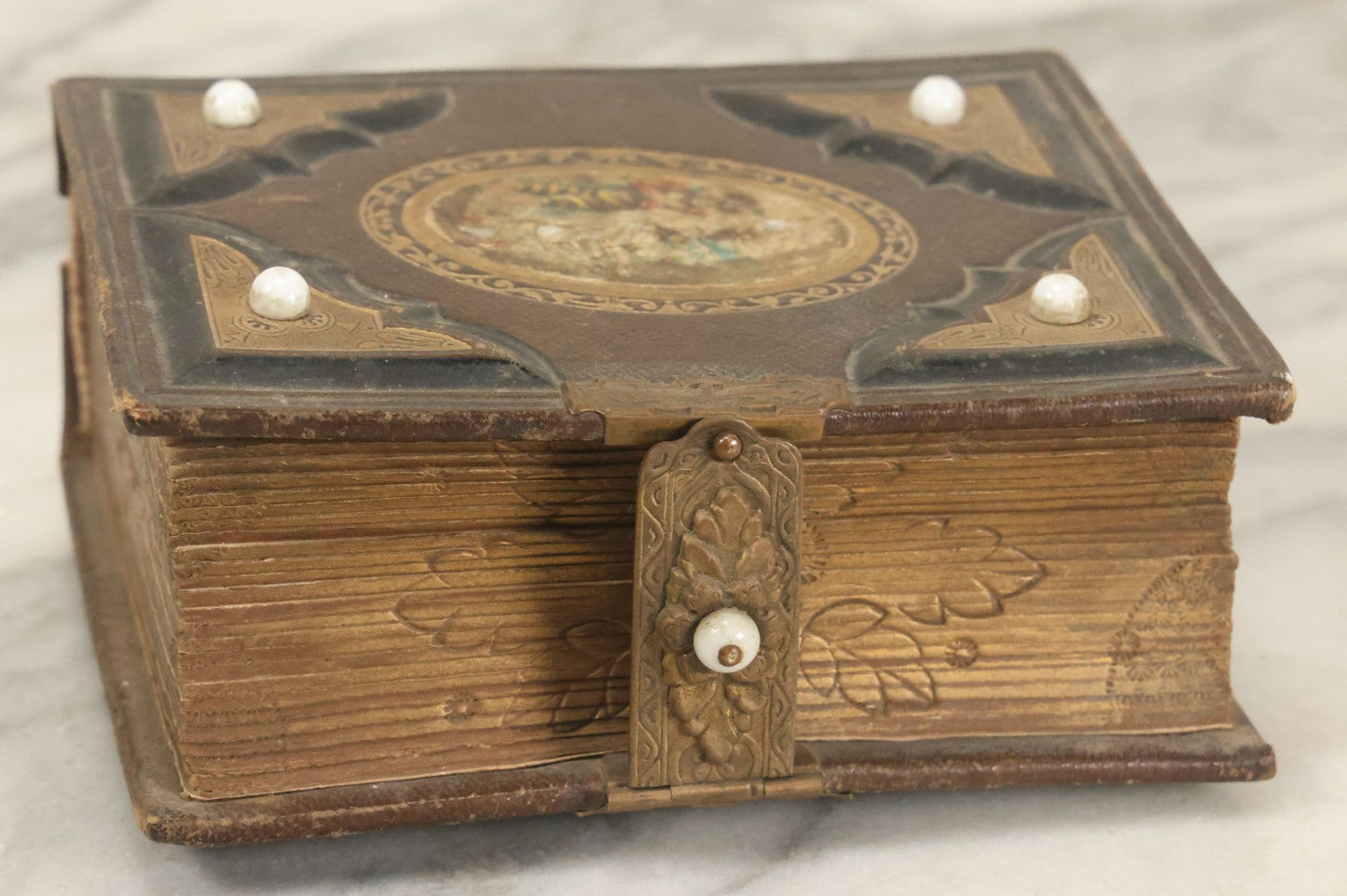 Lot 123 - Antique Cabinet Card And Tintype Family Photo Album, 3 C.D.V. Photos, 10 Tintypes, 2 Illustrated Album Filler Cards, Including Tintype Of Scowling Old Man And Illustrated Card Of Civil War Commander Foot, Cover With Harlequin And Fairy Motif