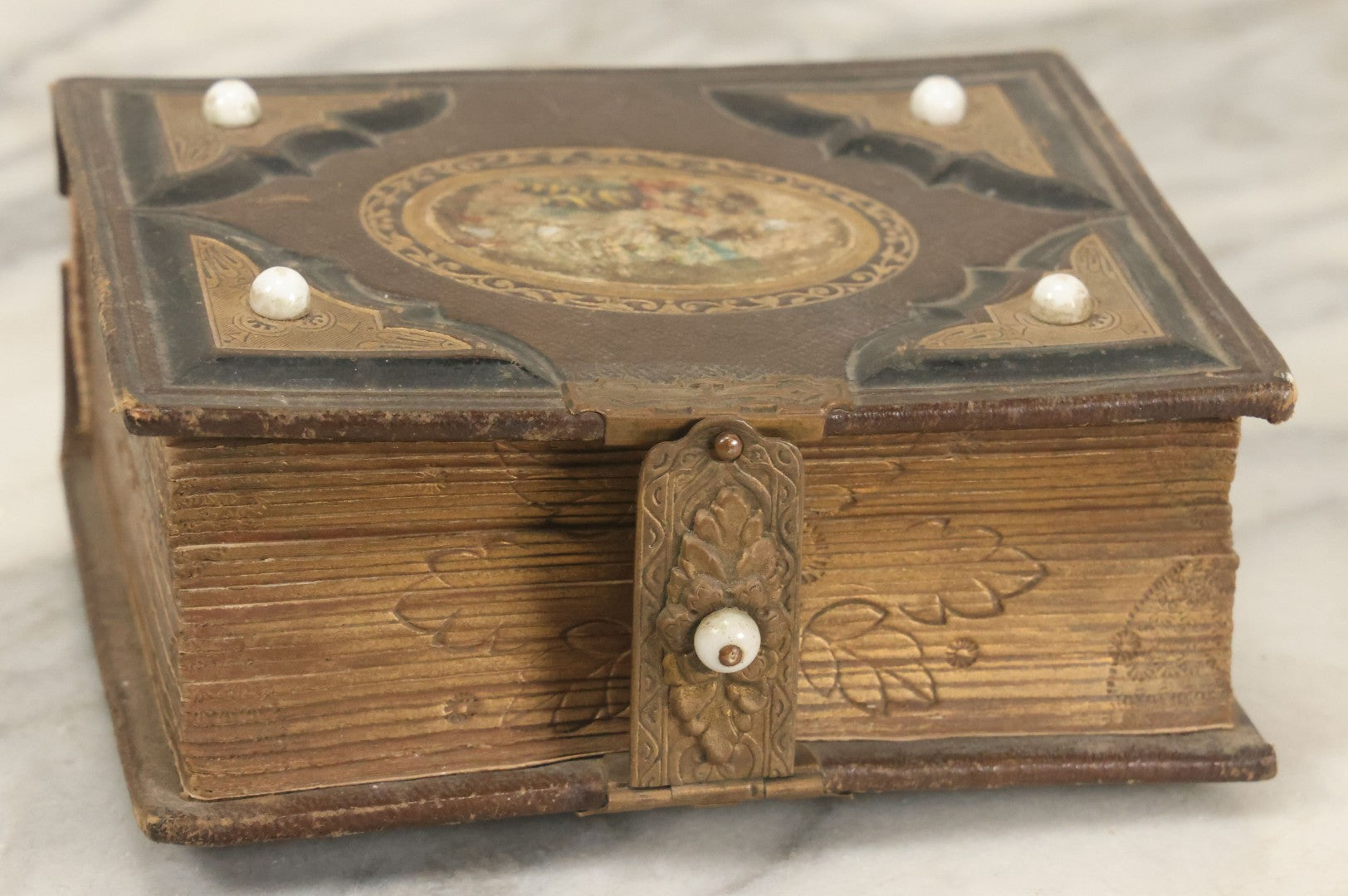 Lot 123 - Antique Cabinet Card And Tintype Family Photo Album, 3 C.D.V. Photos, 10 Tintypes, 2 Illustrated Album Filler Cards, Including Tintype Of Scowling Old Man And Illustrated Card Of Civil War Commander Foot, Cover With Harlequin And Fairy Motif