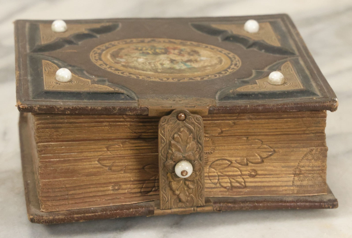 Lot 123 - Antique Cabinet Card And Tintype Family Photo Album, 3 C.D.V. Photos, 10 Tintypes, 2 Illustrated Album Filler Cards, Including Tintype Of Scowling Old Man And Illustrated Card Of Civil War Commander Foot, Cover With Harlequin And Fairy Motif