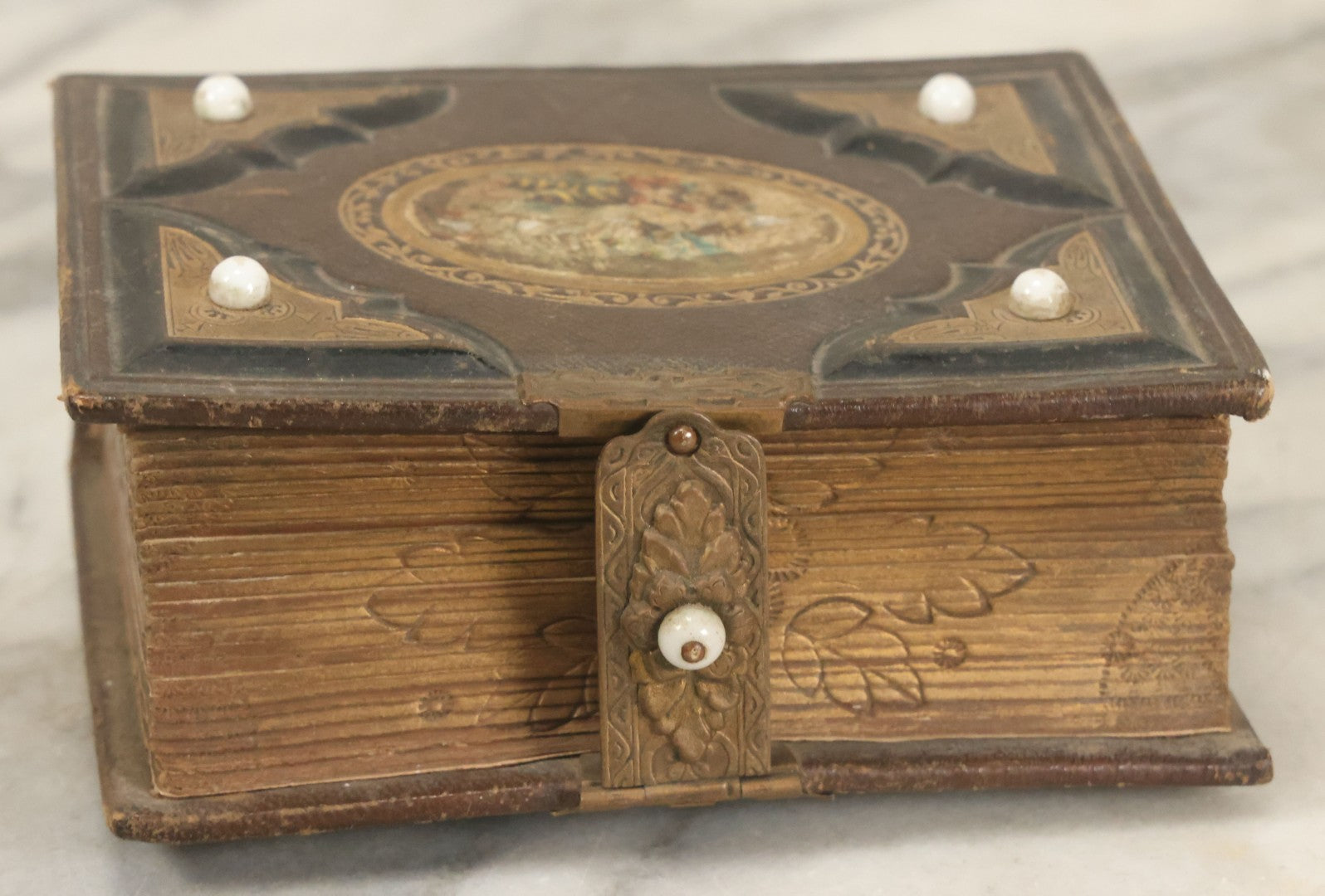 Lot 123 - Antique Cabinet Card And Tintype Family Photo Album, 3 C.D.V. Photos, 10 Tintypes, 2 Illustrated Album Filler Cards, Including Tintype Of Scowling Old Man And Illustrated Card Of Civil War Commander Foot, Cover With Harlequin And Fairy Motif