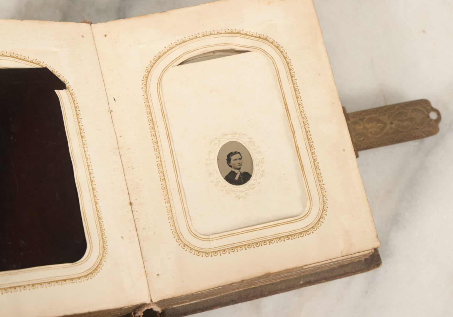 Lot 123 - Antique Cabinet Card And Tintype Family Photo Album, 3 C.D.V. Photos, 10 Tintypes, 2 Illustrated Album Filler Cards, Including Tintype Of Scowling Old Man And Illustrated Card Of Civil War Commander Foot, Cover With Harlequin And Fairy Motif