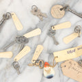 Lot 124 - Grouping Of 10+ Antique Furniture And Other Skeleton Keys With Custom Carved Bone Key Tag Keychains, Including Lucite Eagle Keychain Sold By A Deaf Mute Person