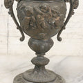 Lot 010 - Antique Ornate Cast Pot Metal Urn With Cherub And Goat Head Motifs, With Makers Mark On Bottom, Marked No. 1409, 9-1/2" High