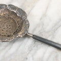 Lot 028 - Antique Sterling Silver Anemone Flower Tea Strainer With Octagonal Black Lacquered Wooden Handle, Marked "Sterling-A"