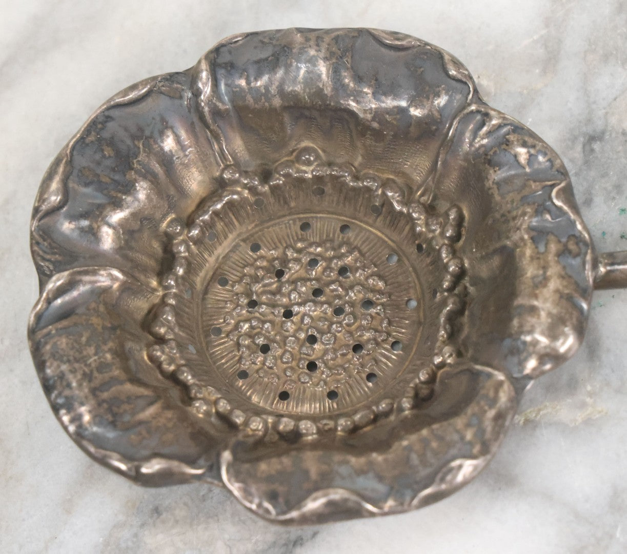 Lot 028 - Antique Sterling Silver Anemone Flower Tea Strainer With Octagonal Black Lacquered Wooden Handle, Marked "Sterling-A"