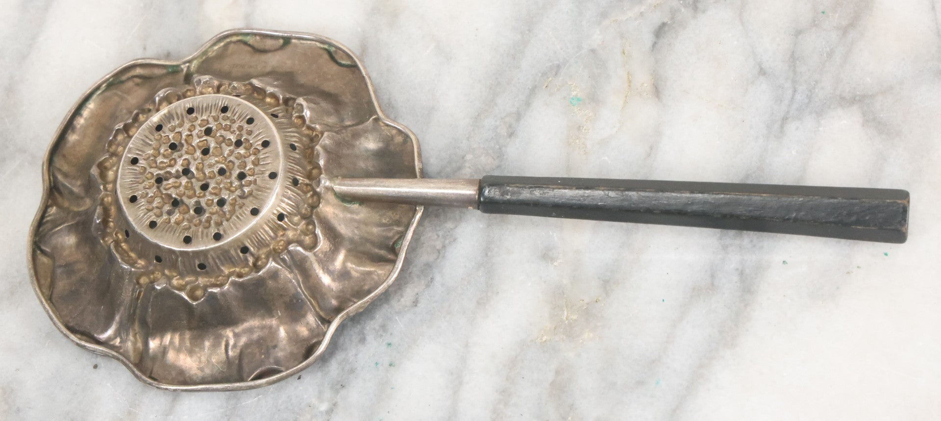 Lot 028 - Antique Sterling Silver Anemone Flower Tea Strainer With Octagonal Black Lacquered Wooden Handle, Marked "Sterling-A"