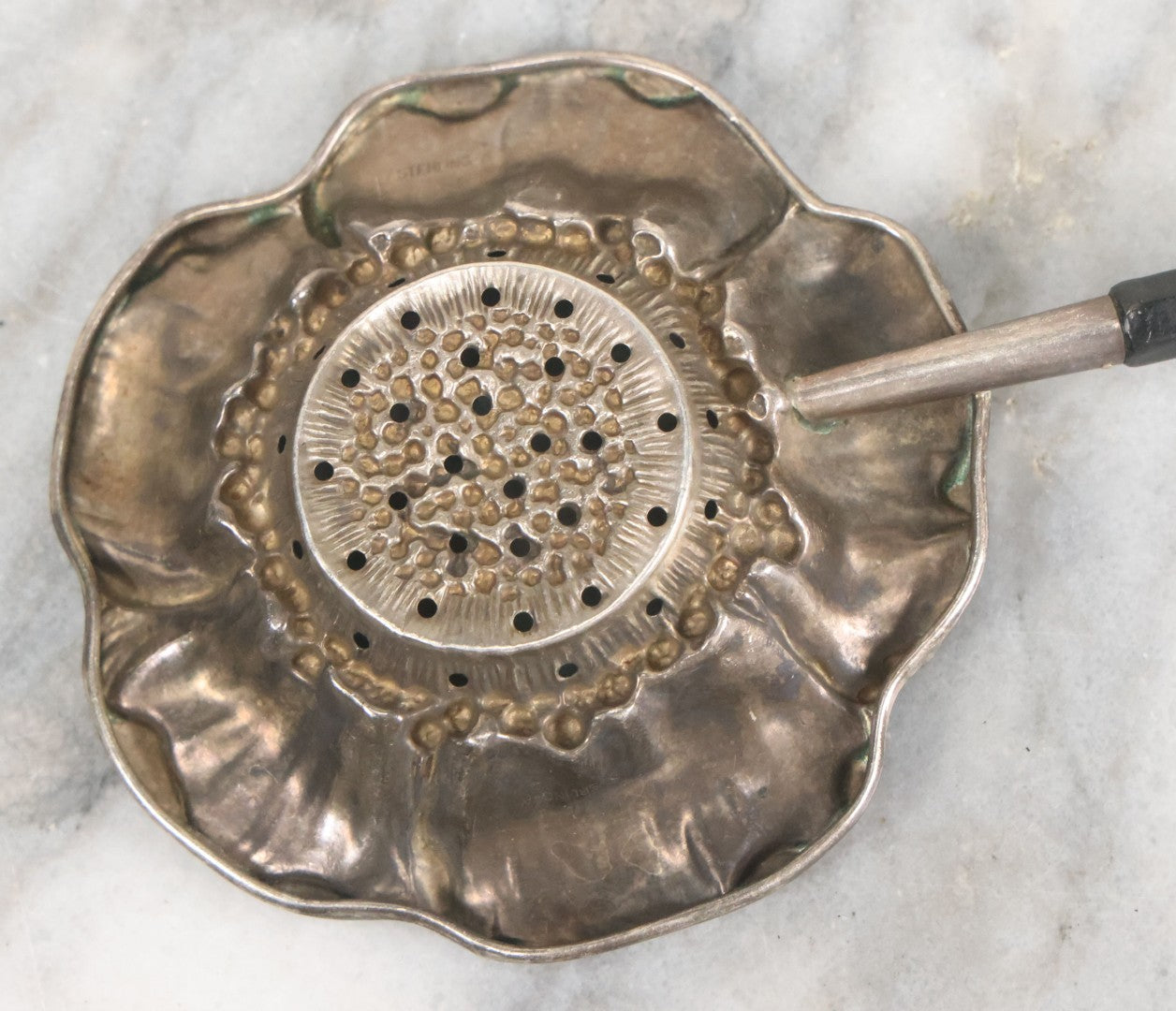 Lot 028 - Antique Sterling Silver Anemone Flower Tea Strainer With Octagonal Black Lacquered Wooden Handle, Marked "Sterling-A"