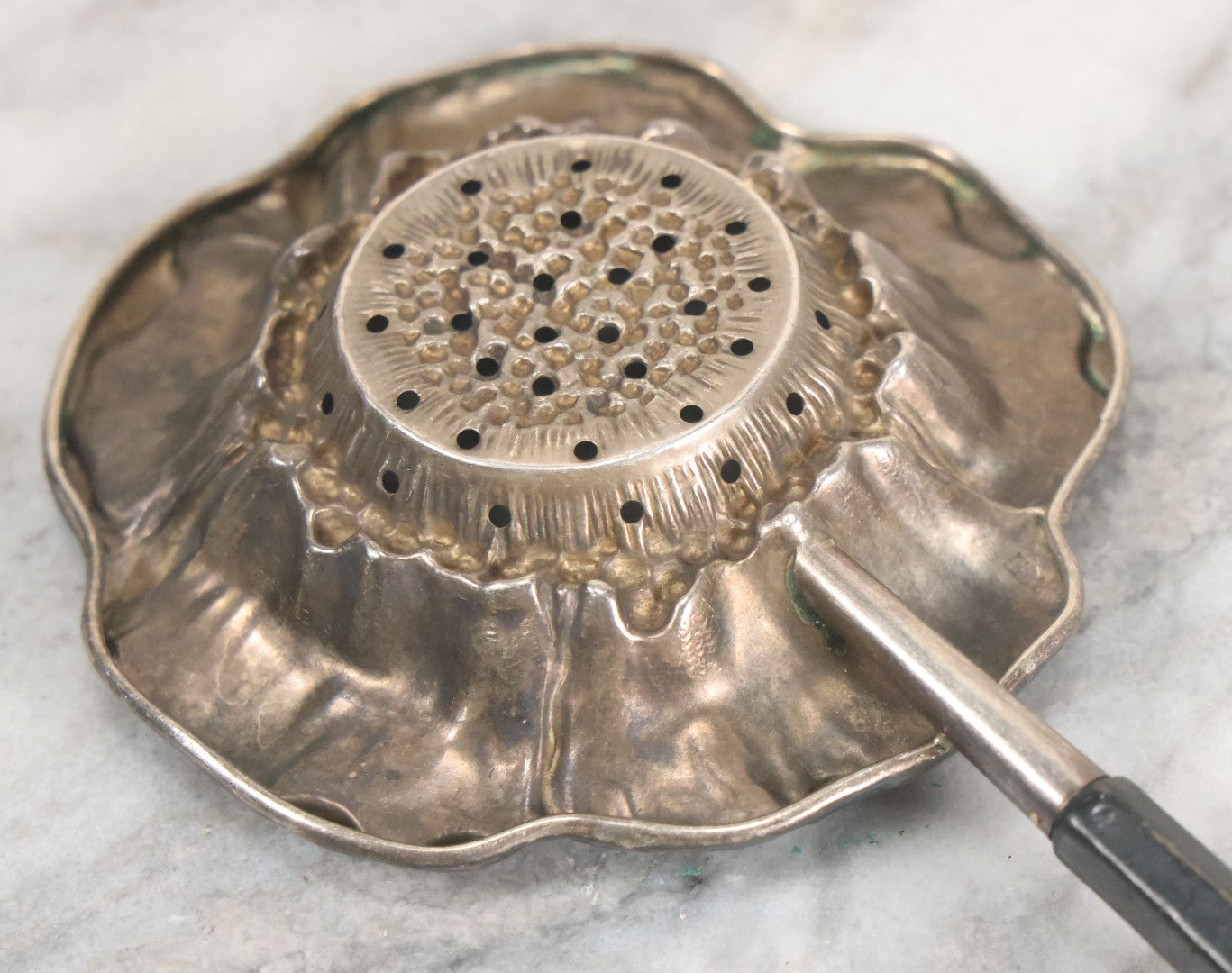 Lot 028 - Antique Sterling Silver Anemone Flower Tea Strainer With Octagonal Black Lacquered Wooden Handle, Marked "Sterling-A"