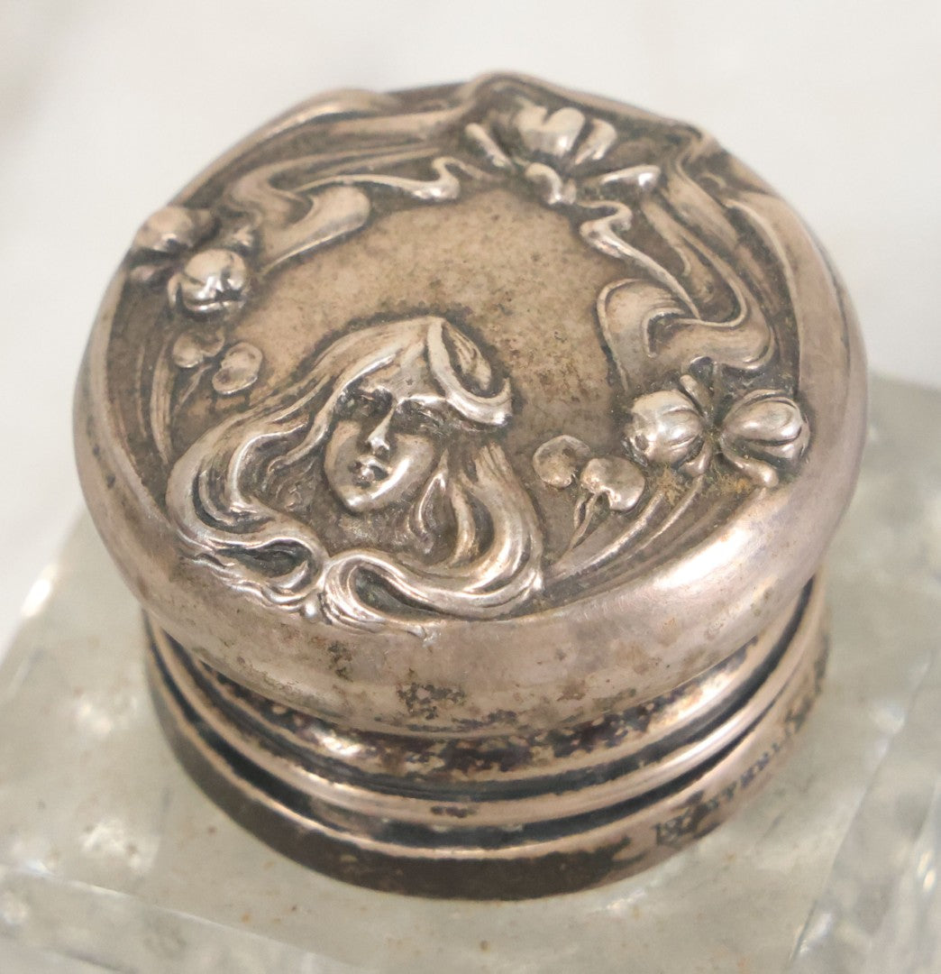 Lot 029 - Antique Cut Glass Inkwell With Art Nouveau Sterling Silver Lid With Woman Head And Lily Motif, Marked Sterling, With Hallmark, No. 1560