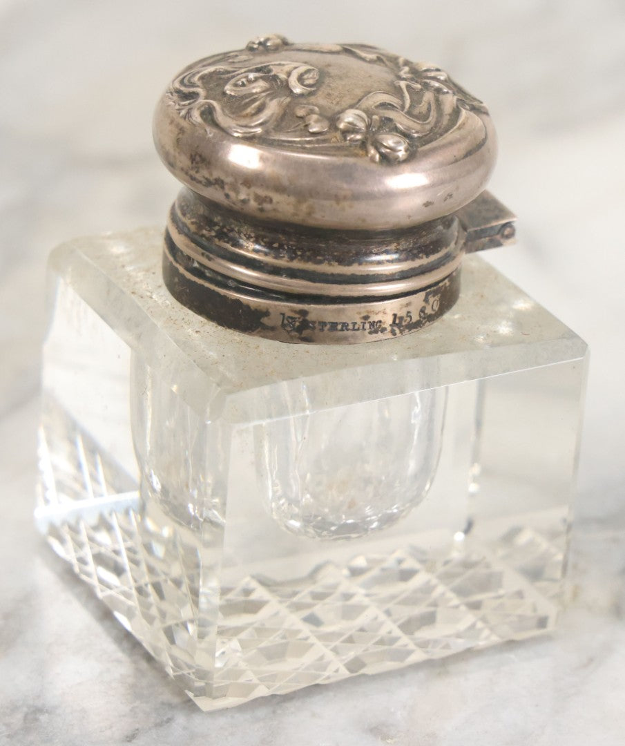 Lot 029 - Antique Cut Glass Inkwell With Art Nouveau Sterling Silver Lid With Woman Head And Lily Motif, Marked Sterling, With Hallmark, No. 1560