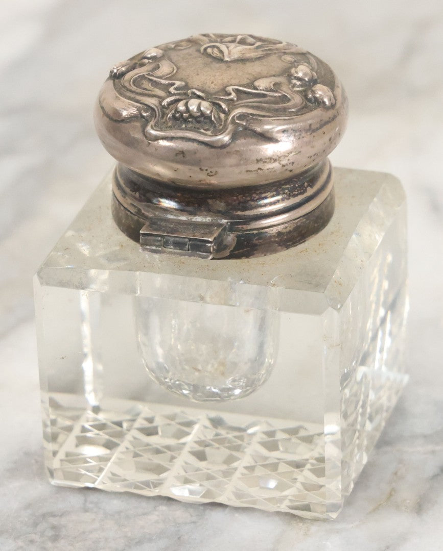 Lot 029 - Antique Cut Glass Inkwell With Art Nouveau Sterling Silver Lid With Woman Head And Lily Motif, Marked Sterling, With Hallmark, No. 1560