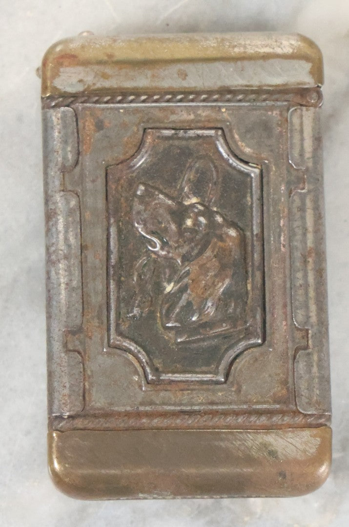 Lot 031 - Antique Tin Hunter's Match Safe With Elk, Hunting Dog, And Fishing Hook Motif, Circa 1920s, Note Minor Rust