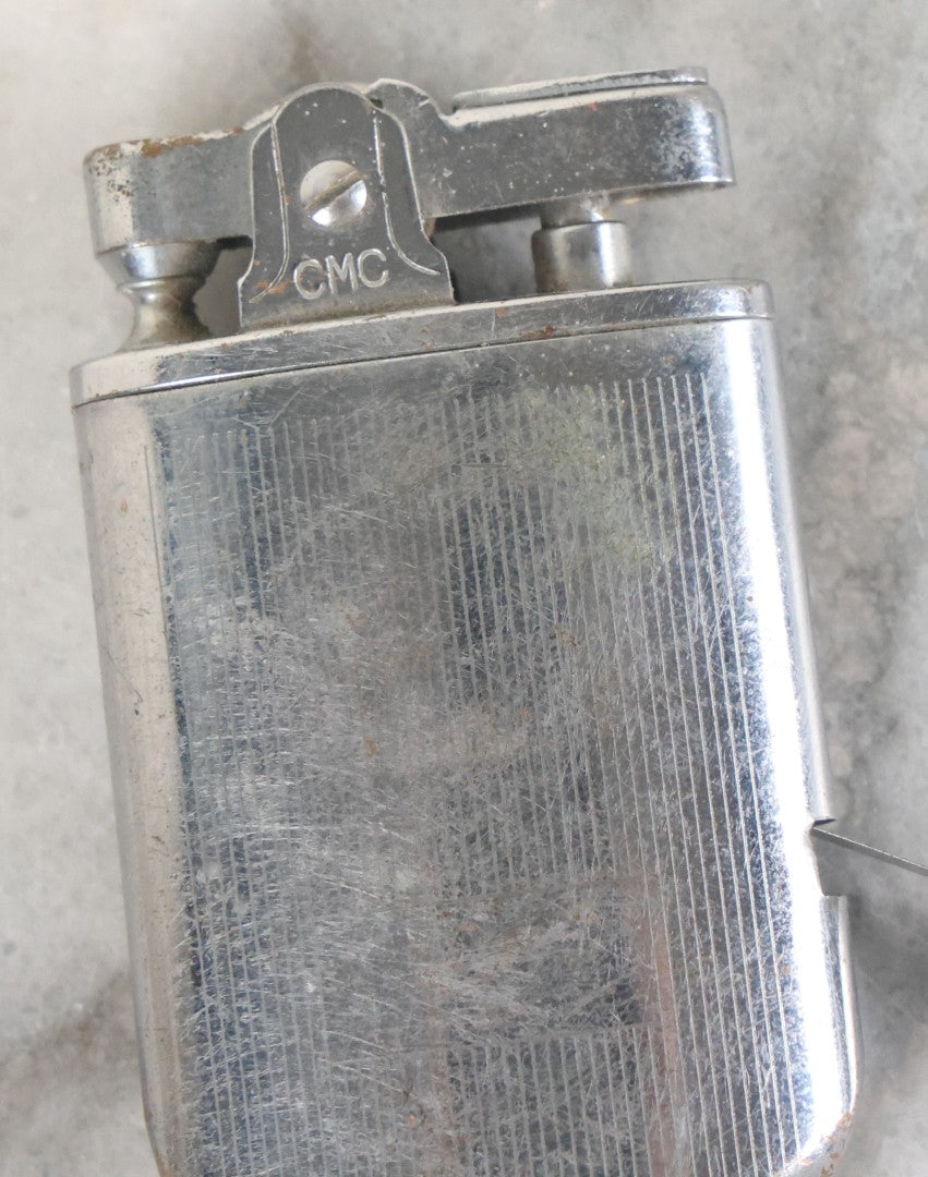 Lot 033 - Vintage Novelty Lighter And 36 Inch Tape Measure Combo, C.M.C., New Flint, Working Condition