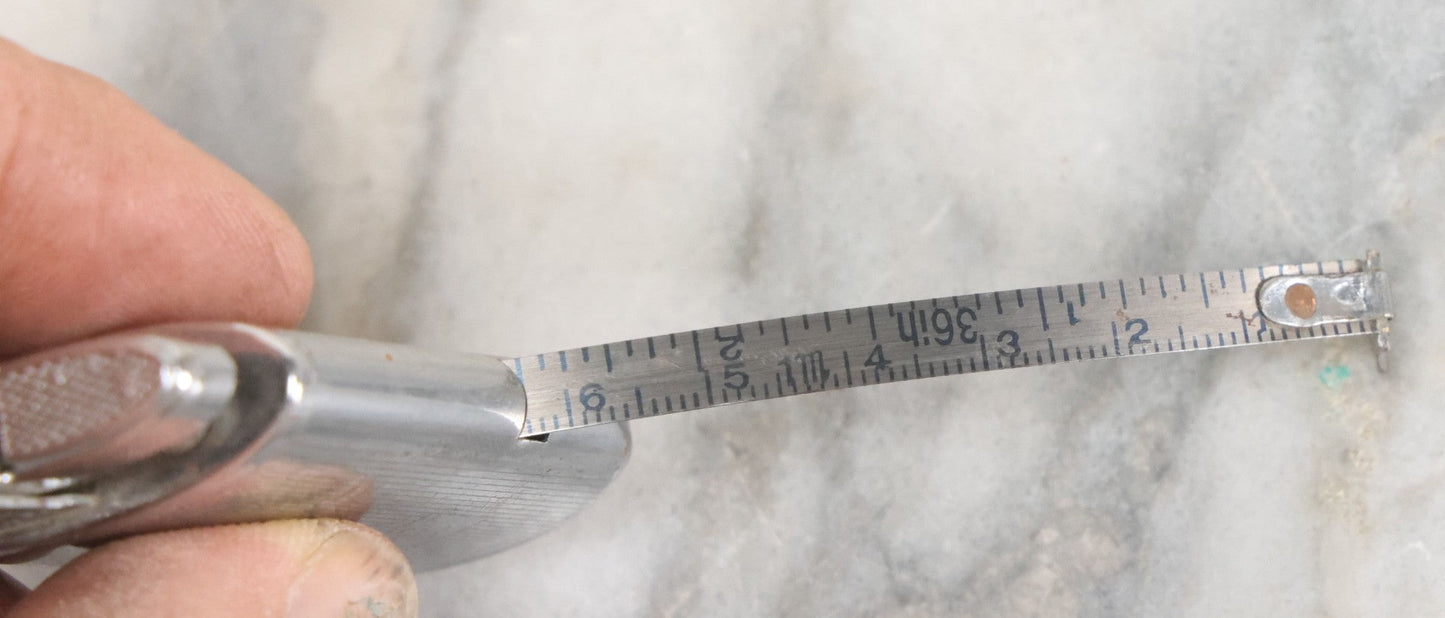 Lot 033 - Vintage Novelty Lighter And 36 Inch Tape Measure Combo, C.M.C., New Flint, Working Condition