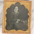 Lot 055 - Antique 1/6th Plate Daguerreotype Photograph Of Middle Aged Woman With Paisley Necktie Seated With A Book On Table