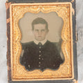 Lot 058 - Antique 1/9th Plate Ruby Ambrotype Photograph Of Stern Looking Young Boy With Tinted Details, In Split Half Leatherette Union Case