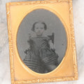 Lot 059 - Antique 1/9th Plate Ruby Ambrotype Photograph Of Young Girl Toddler With Off Shoulders Dress In Child's Armchair Clutching Chair Arms, Note Underexposure, Uncased
