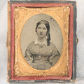 Lot 061 - Antique 1/9th Plate Ambrotype Photograph Of Young Woman, Appears To Have Been Defaced To Give Her A Beard And Other Comic Embellishments, Poor Condition, In Split Half Leatherette Union Case