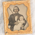 Lot 062 - Antique 1/9th Plate Ambrotype Photograph Of Young Smiling Father And Infant Child, Note Large Diagonal Crack Through Ambrotype, Uncased, Poor Condition