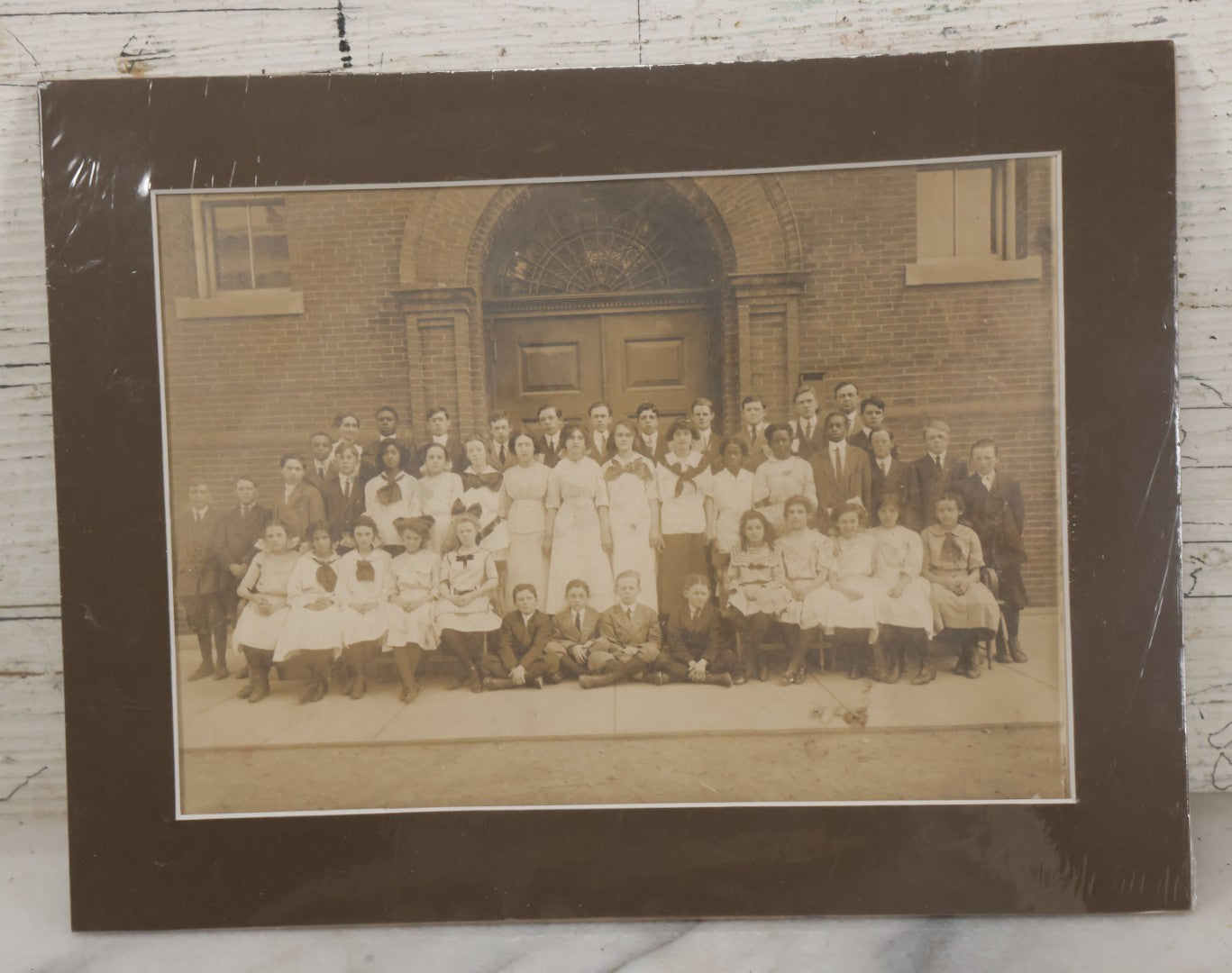 Lot 068 - Antique Photograph Of Schoolchildren, Interracial Class, Outside Of Brick Schoolhouse Including Many Young Girls And Boys And Teachers, Matted And Shrink Wrapped