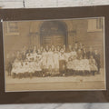 Lot 068 - Antique Photograph Of Schoolchildren, Interracial Class, Outside Of Brick Schoolhouse Including Many Young Girls And Boys And Teachers, Matted And Shrink Wrapped