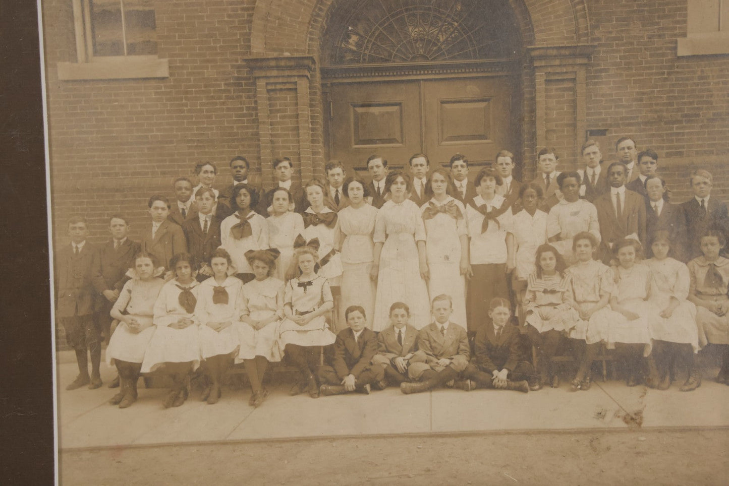 Lot 068 - Antique Photograph Of Schoolchildren, Interracial Class, Outside Of Brick Schoolhouse Including Many Young Girls And Boys And Teachers, Matted And Shrink Wrapped