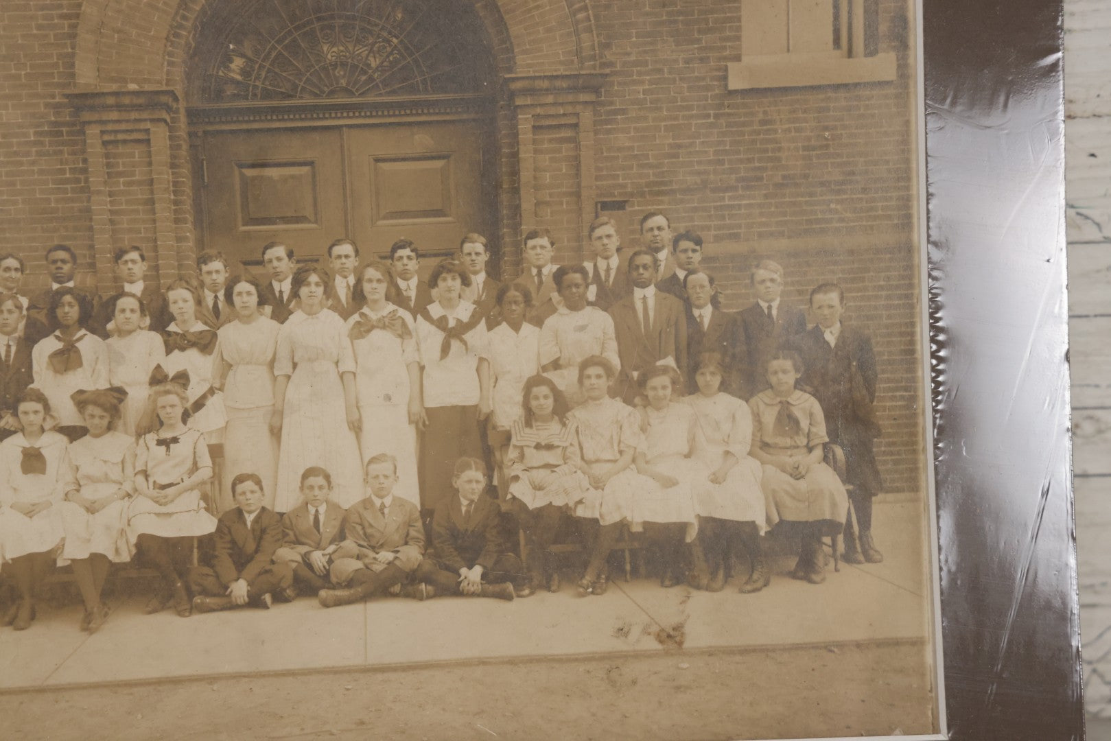 Lot 068 - Antique Photograph Of Schoolchildren, Interracial Class, Outside Of Brick Schoolhouse Including Many Young Girls And Boys And Teachers, Matted And Shrink Wrapped