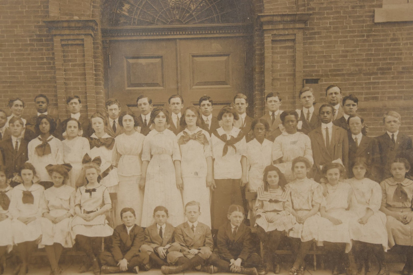 Lot 068 - Antique Photograph Of Schoolchildren, Interracial Class, Outside Of Brick Schoolhouse Including Many Young Girls And Boys And Teachers, Matted And Shrink Wrapped