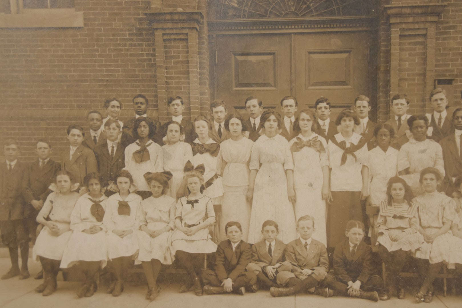 Lot 068 - Antique Photograph Of Schoolchildren, Interracial Class, Outside Of Brick Schoolhouse Including Many Young Girls And Boys And Teachers, Matted And Shrink Wrapped