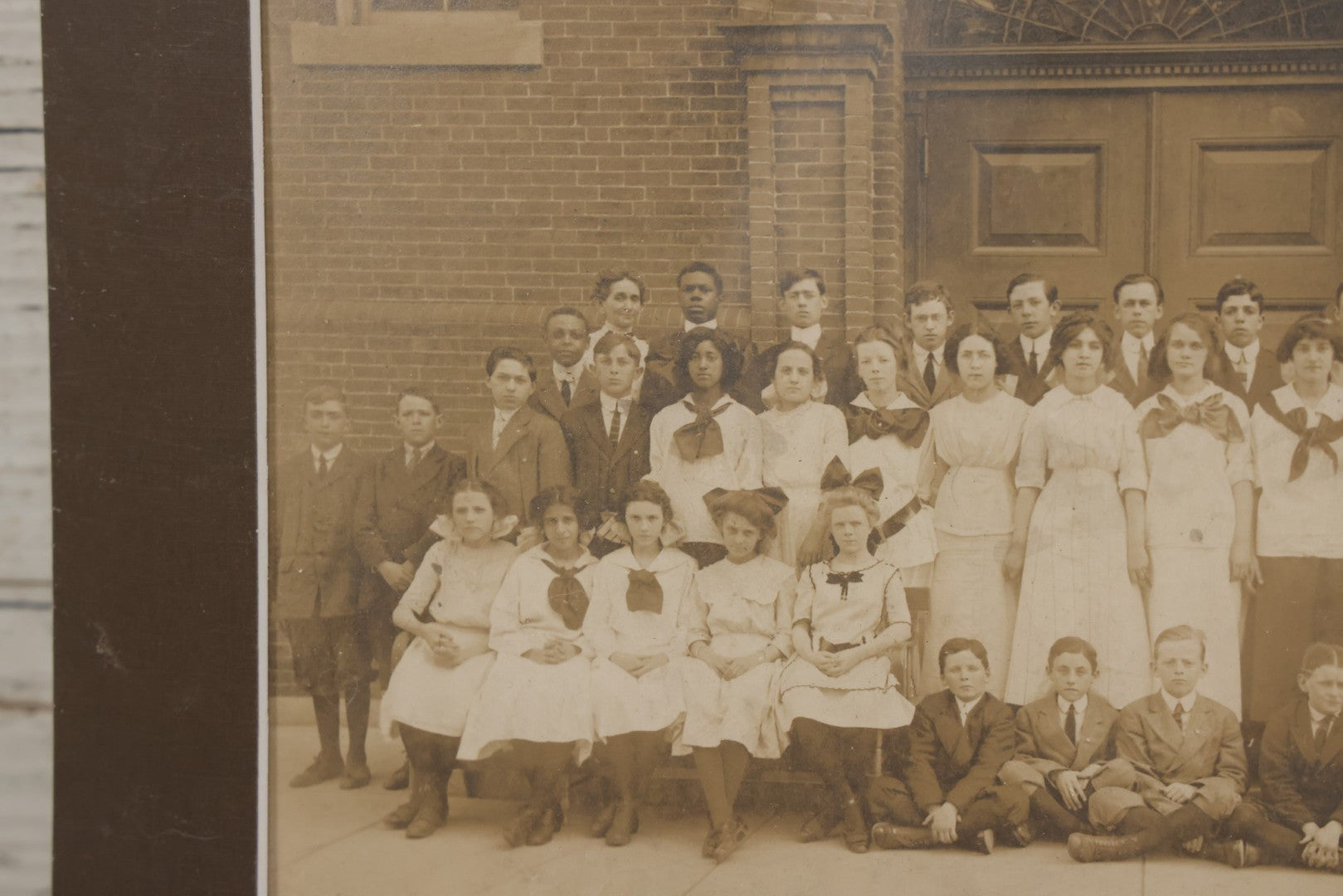 Lot 068 - Antique Photograph Of Schoolchildren, Interracial Class, Outside Of Brick Schoolhouse Including Many Young Girls And Boys And Teachers, Matted And Shrink Wrapped