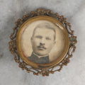 Lot 072 - Antique Photo Button Keepsake With Photograph Of Stern Man With Black Collar And Moustache, Diameter 1-1/8"