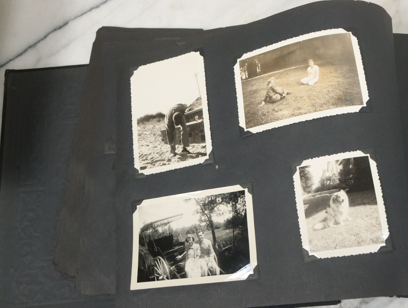 Lot 076 - Vintage Snapshot Photo Album Containing Mostly Photos Of Children And Family And Photos Of Times Square, New York City, Wedding Photos, With Pirate On Cover, Circa 1940s, Note Cover Detached, All Photos Pictured