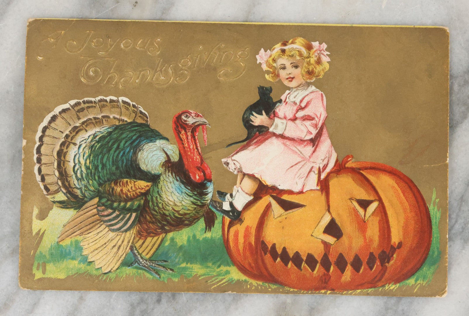 Lot 079 - Antique "A Joyous Thanksgiving" Embossed Postcard With Halloween Pumpkin Jack-O-Lantern, J.O.L., Black Cat And Turkey, Not Postmarked, Note Worn Back