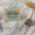Lot 091 - Vintage And Antique 3 Item Bar Related Grouping Including Corkscrew From Providence Brewing Company, Bottle Opening Tool From Green River Whiskey, And Box Of New Old Stock N.O.S. World's Fair Toothpicks