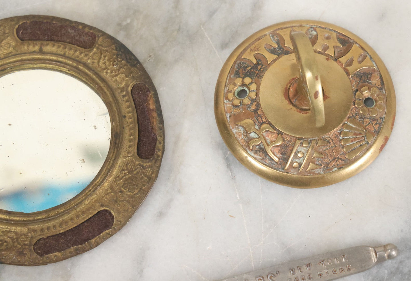 Lot 092 - Antique 3 Item Metal Grouping Including Miniature Pocket Mirror, Brass Doorbell Knob, And Advertising Button Hook For Reynolds' Shoe Store, Milford Massachusetts