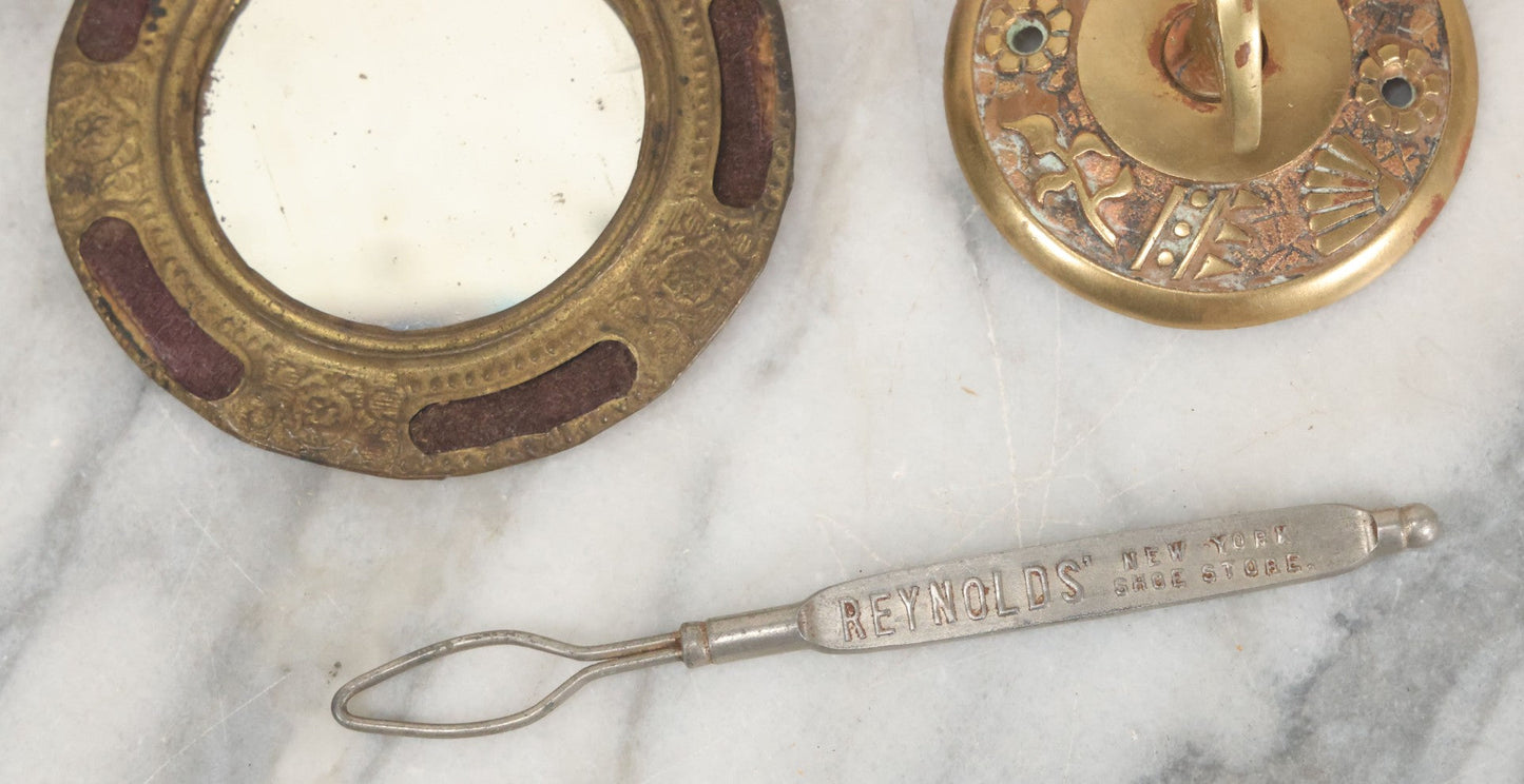 Lot 092 - Antique 3 Item Metal Grouping Including Miniature Pocket Mirror, Brass Doorbell Knob, And Advertising Button Hook For Reynolds' Shoe Store, Milford Massachusetts