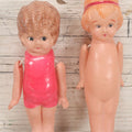 Lot 096 - Pair Of Vintage Celluloid Flapper Dolls, Made In Japan, One With Pink Headband And One With Pink Swimsuit